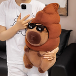 Person holding a capybara plush with a brown swirl hat and pixel sunglasses