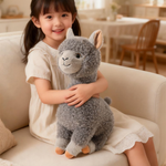Girl smiling while hugging a gray fluffy alpaca plush on a cream sofa