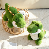 Green alligator plush toys sitting and lying near a woven basket on a sunny rug