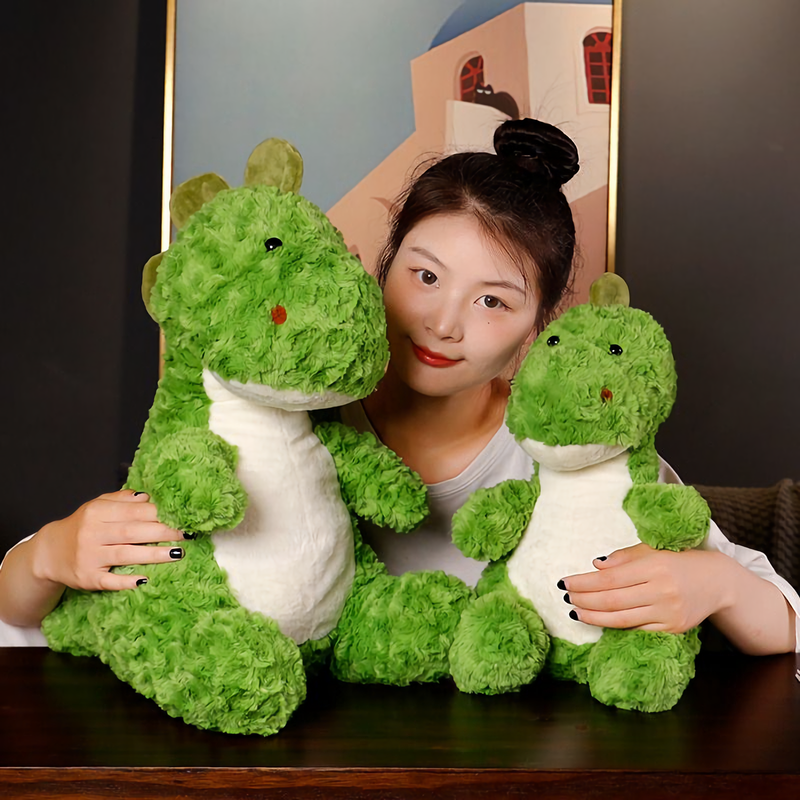 Woman hugging two green dinosaur plush toys on a dark sofa