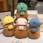 Capybara plushies in chick, pig, shark and dinosaur hoods on a white shelf