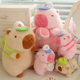 Brown and pink sporty capybara plushies in different sizes with tennis and baseball balls
