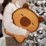 Woman hugging a large bread capybara plush