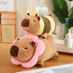 Capybara plush in a pink flower collar with a bee capybara plush on its back