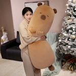 Woman standing and hugging a tall tan capybara bolster pillow