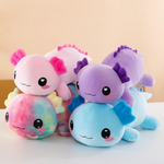 Stack of pink, rainbow, purple and blue axolotl plush pillows with smiling faces