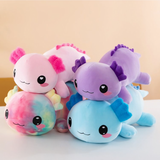 Stack of pink, rainbow, purple and blue axolotl plush pillows with smiling faces