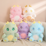 Five Kawaii baby dragon plushies in white, pink, green, blue, and purple sitting on a beige sofa.
