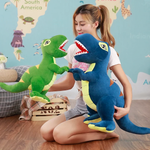 Woman holding blue and green T-Rex plush dinosaurs on the floor, facing each other.