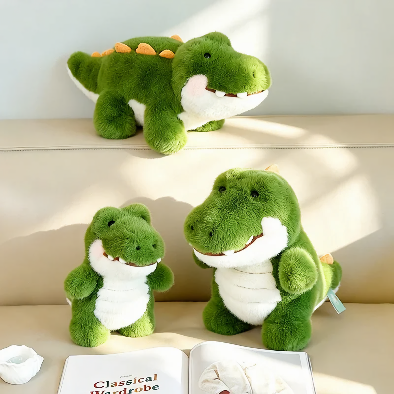 Green alligator plush toys on a beige sofa, one lying and two sitting