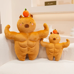 Small and large muscle capybara plushies with oranges on their heads on a sofa