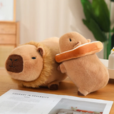 Lion capybara plush and a bread capybara plush on a wooden table
