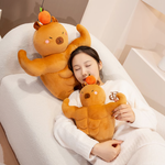Woman lying on a sofa with two muscle capybara plushies