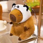 Capybara plush in a panda hood on a metal shelf