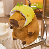 Capybara plush in a yellow pineapple hood on a metal shelf
