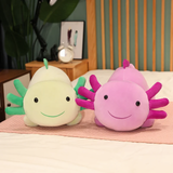 Green axolotl plush and a purple axolotl plush lying side by side on a bed