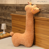 Brown long alpaca plush pillow standing against a wooden headboard