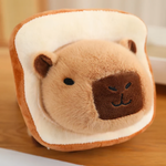 Close-up of a capybara plush in a bread slice costume