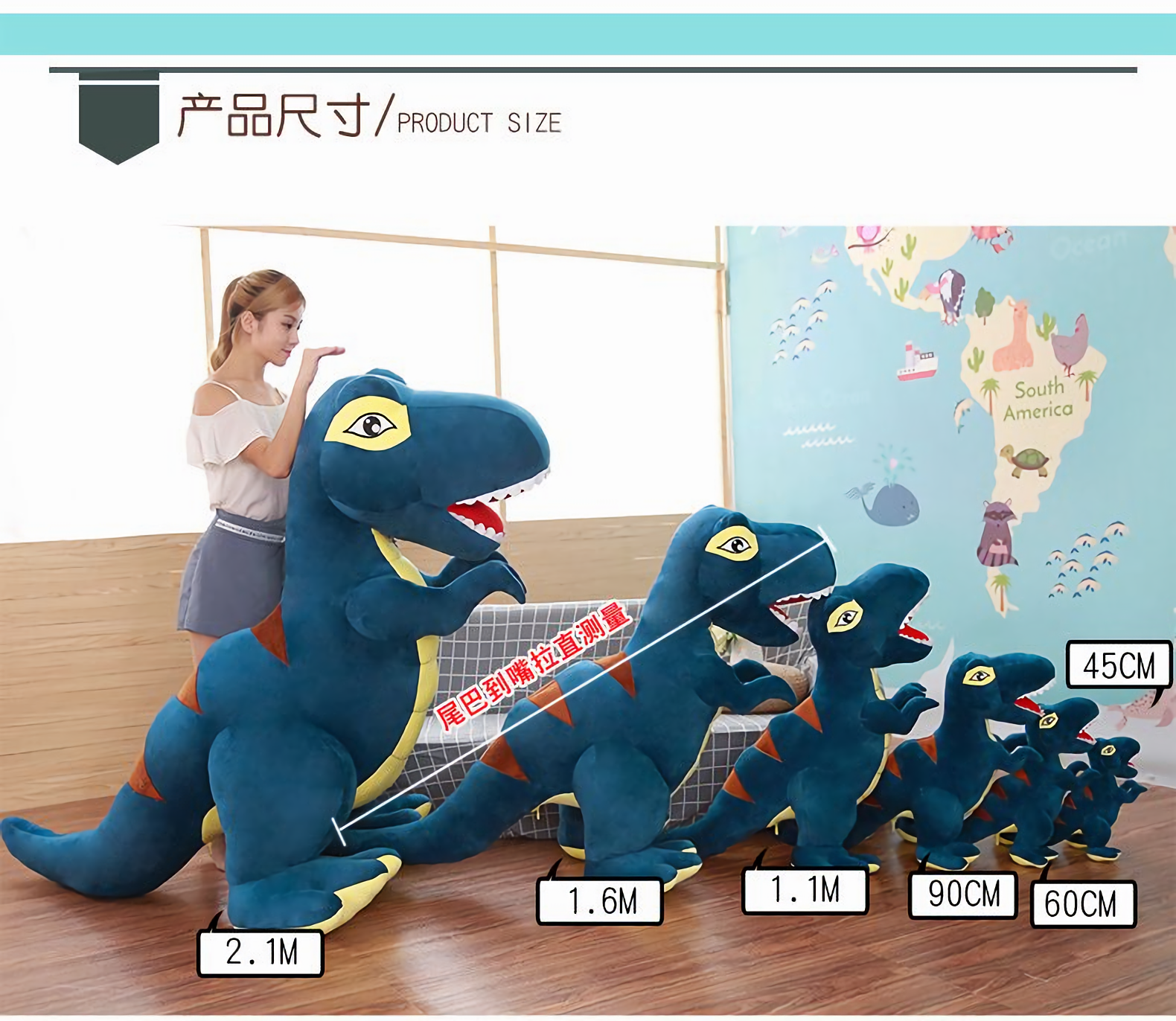Woman with 2.1m blue and green T-Rex plush beside smaller plush sizes, in a room with a world map wall.