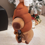 Person lifting a capybara plush with a brown swirl hat and sunglasses hanging down