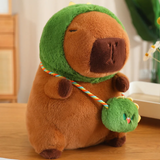 Capybara plush in a green dinosaur hood with a matching mini bag