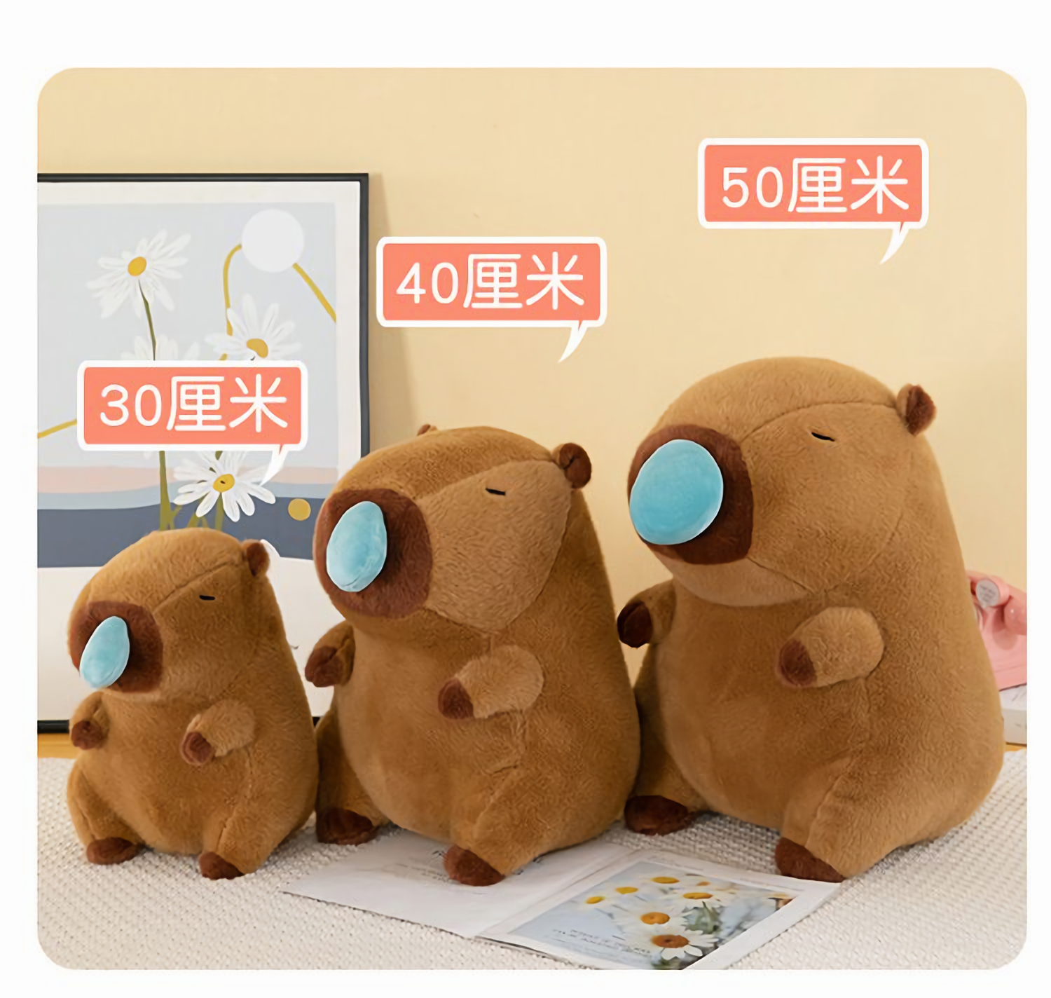 Size comparison of three brown capybara plushies with blue nose bubbles marked 30cm, 40cm and 50cm
