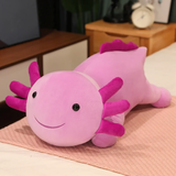 Purple axolotl plush pillow with magenta gills and a smiling face