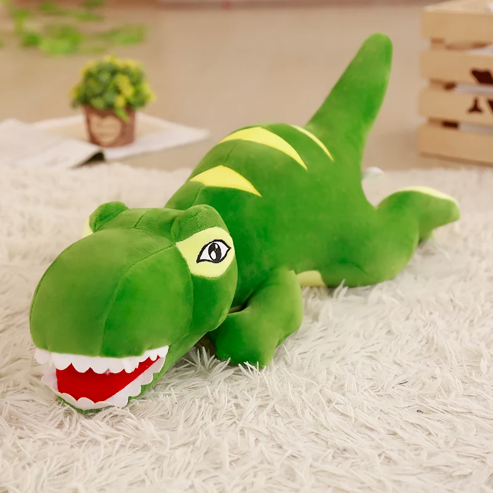 Long green T-Rex plush pillow with yellow stripes lying on a rug