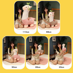 Size comparison of pink and gray alpaca plushies with headphones held by a woman with cm labels