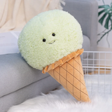 Mint green ice cream cone plush pillow with a smiling face and a quilted waffle cone