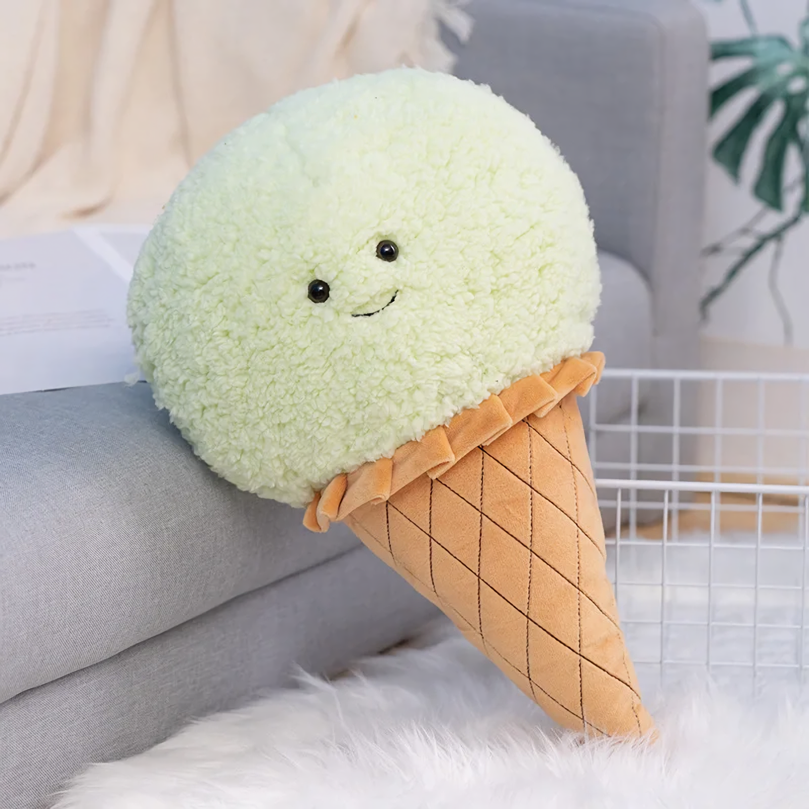 Mint green ice cream cone plush pillow with a smiling face and a quilted waffle cone