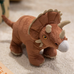 Brown Triceratops plush on a beige carpet, showing detailed horns and eyes in a well-lit room.