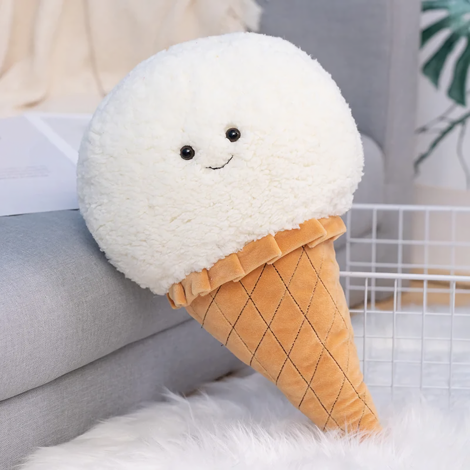 White ice cream cone plush pillow with a smiling face and a quilted waffle cone