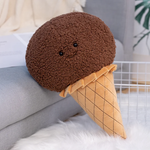 Brown ice cream cone plush pillow with a smiling face and a quilted waffle cone
