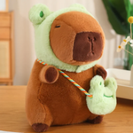 Capybara plush in a green frog hood with a frog mini bag