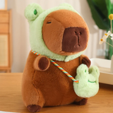 Capybara plush in a green frog hood with a frog mini bag