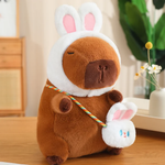 Capybara plush in a white rabbit hood with a rabbit mini bag
