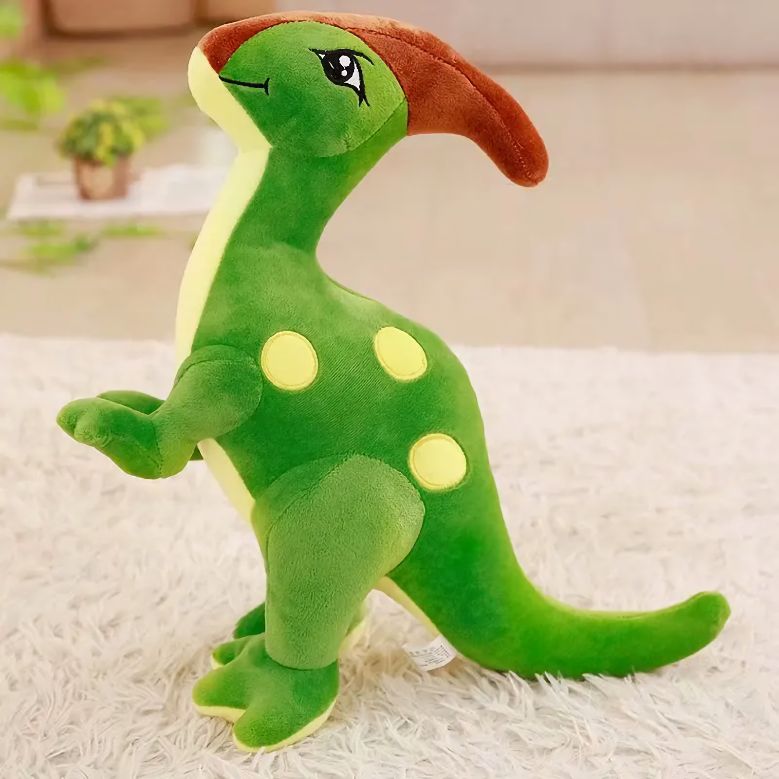 Green Parasaurolophus dinosaur plush with a brown crest and yellow spots on a rug