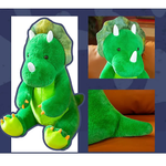 Green plush triceratops toy with a smiling face, three horns, and colorful feet, shown from multiple angles.