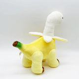 A plush toy shaped like a dinosaur with a yellow body and a white head resembling a banana peel.