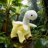 Plush toy resembling a dinosaur with a banana-themed body, set in a lush, green jungle environment.