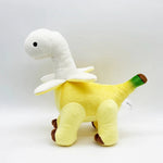 Plush toy resembling a dinosaur with a yellow body, white neck, and green tail, featuring brown feet.