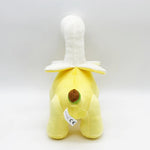 Plush toy shaped like a dinosaur with a banana design, featuring a yellow body and white details.