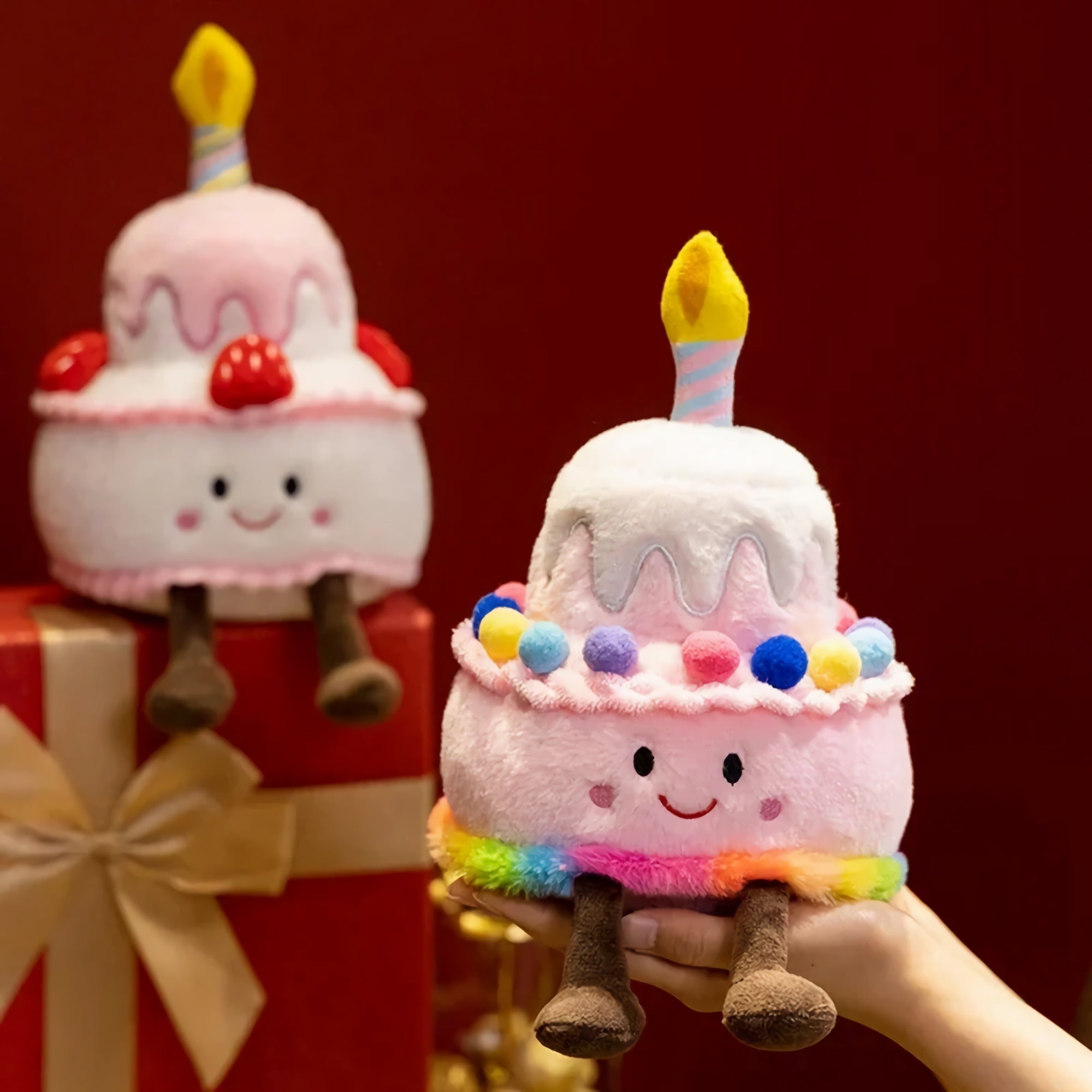 Kawaii plush pillow shaped like a birthday cake with a candle, colorful sprinkles, and smiling face.