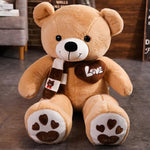 Kawaii jumbo teddy bear plush with a scarf, featuring a heart and paw print details.
