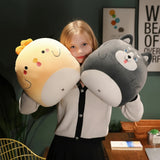 A child holding two plush pillows shaped like a chick and a dog.
