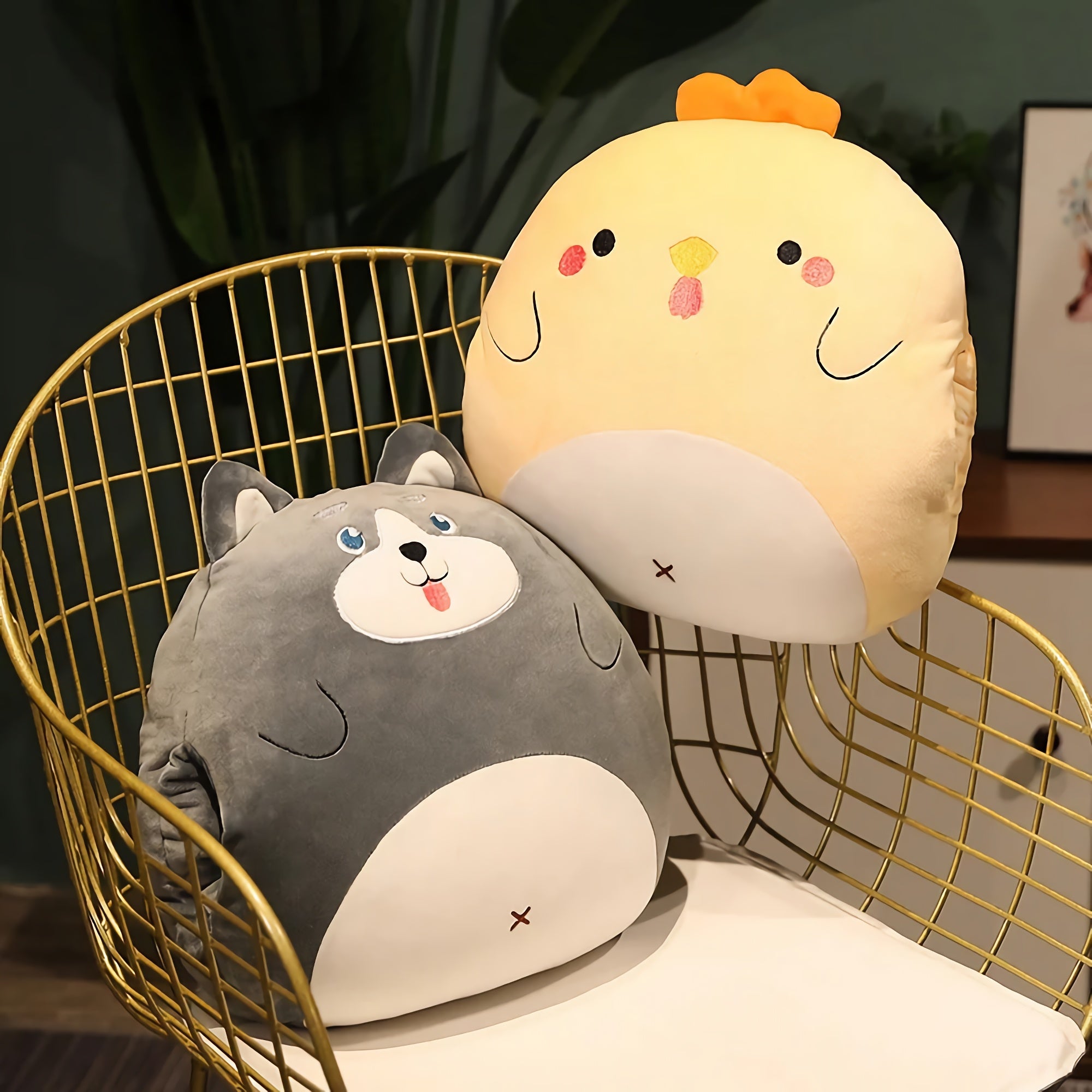 Two plush pillows shaped like a gray dog and a yellow chick on a wire chair.