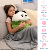 Girl on a couch holding a panda plush pillow with a gray blanket, icons on the side.