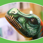 Lifelike Spinosaurus plush pillow with detailed green and orange features, showcasing its head and textured skin.