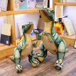Two plush Spinosaurus dinosaur toys standing on a wooden floor with bookshelves in the background.